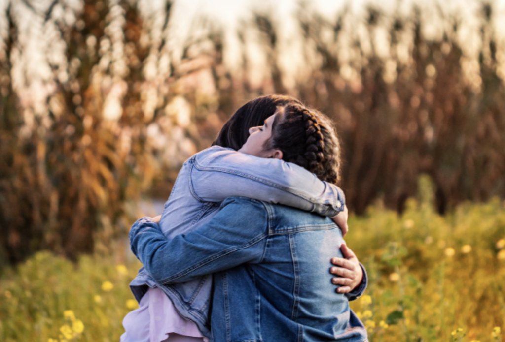 A picture of girls hugging each other